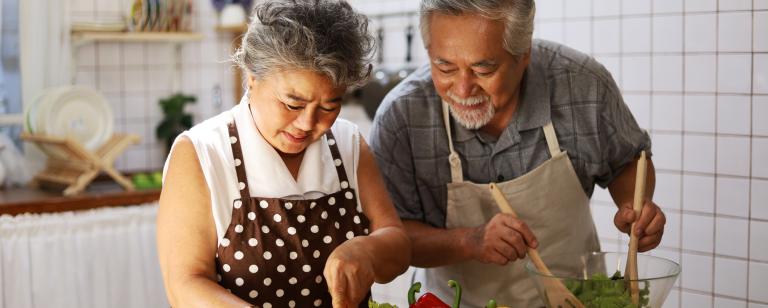 Senior couple cooking together