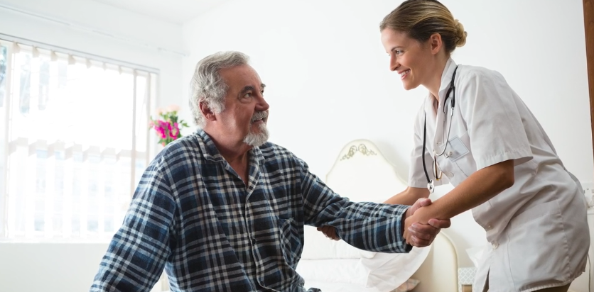 nurse helping man